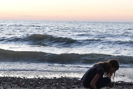 Collecting seashell beside the beach